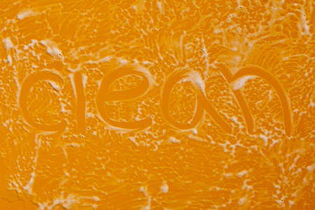 Texture of white soap foam with bubbles abstract yellow background, Soap, shower gel, shampoo, Face Cream cleansing mousse sample.の写真素材