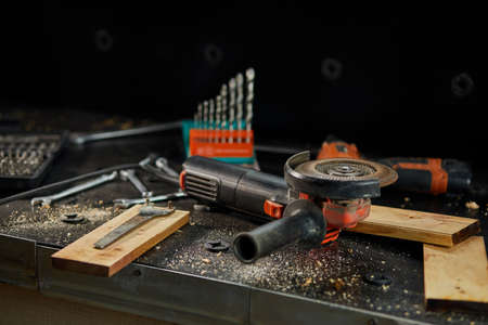 Close up of grinder machine is working, rotation. grinds a metal in workshop, metalworking.