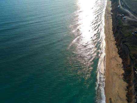 Aerial view of sandy beach and sea with waves, Top view, amazing nature background, beach and clear...