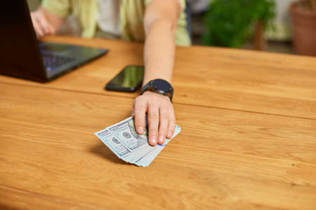 Businessman hands take cash american dollars banknotes, Finance and money payment concept, Close up...