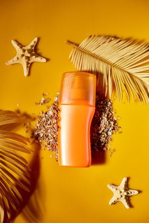 Top view, flat lay Sunscreen tube mockup with shells, sand yellow background, summer vacations and...