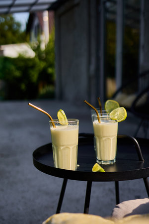 Creamy Lime Cocktail with Condensed Milk in a Refreshing Tropical Styleの写真素材