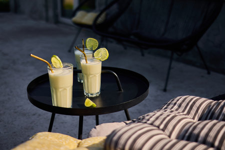 Creamy Lime Cocktail with Condensed Milk in a Refreshing Tropical Styleの写真素材