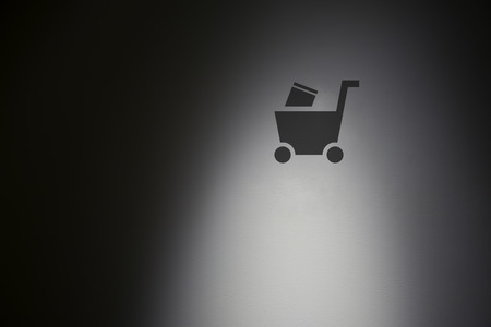 Shopping symbol in highlight concrete wall.の写真素材