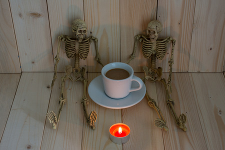 Two skeleton man talking something in coffee break time on dim light.の写真素材