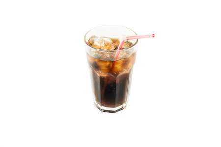 Glass of cola red straw with roll ice isolate white backgroundの写真素材