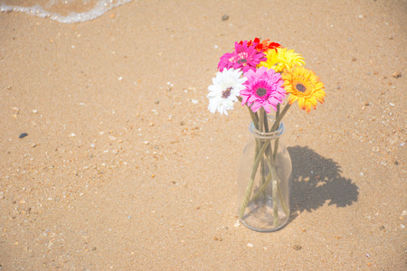 Artificial flowers on the beautiful beachの写真素材