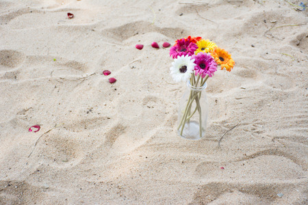 Artificial flowers on the beautiful beachの写真素材