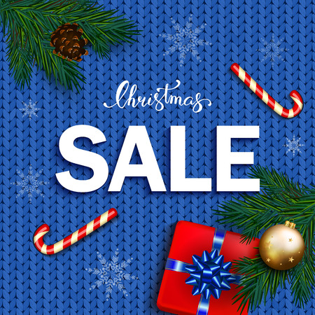 Christmas sale banner with box gifts with bow, candy cane, bubble on blue knitted background. Christmas ornament decorations.のイラスト素材