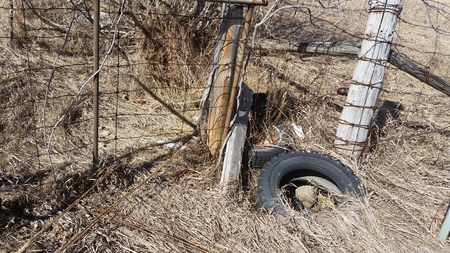 Forgotten Tire and Fence in the Countryの写真素材