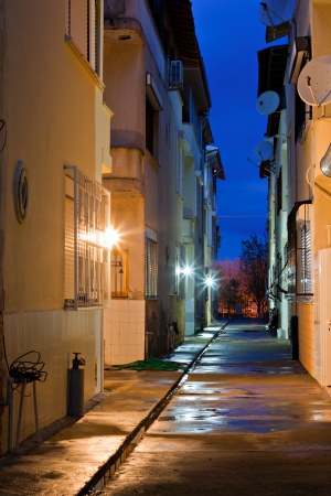 Dark empty back alleyway after the rainの写真素材