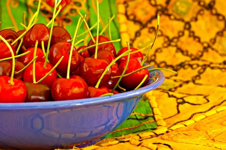 Digital painting of a bowl of ripe red cherries
