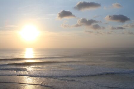 cloudy sunset on beachの写真素材