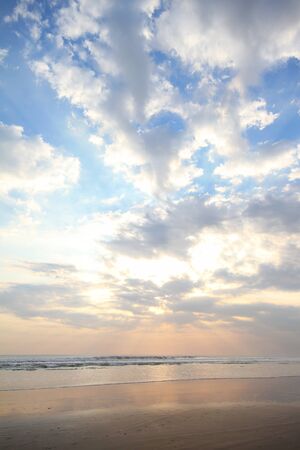 cloudy sky sunset on the beachの写真素材