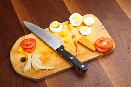 Knife on wooden cutboardの写真素材