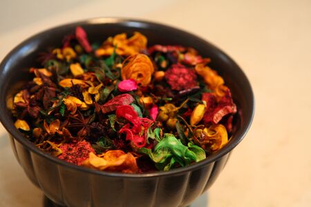 A bowl of fragrant dry herbs aromatheraphyの写真素材