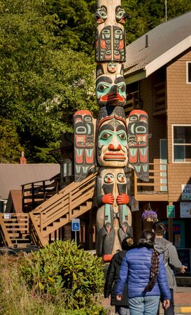 Sept. 17, 2018 - Ketchikan, AK: Tourists and Chief Johnson Totem Pole, sunny day