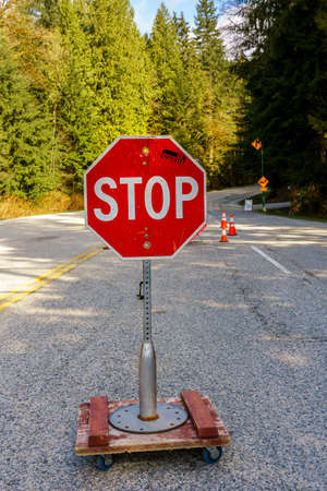 North Vancouver, Canada - Ap 7, 2020: Stop sign controls access to Mt. Seymour Provincial Park during Covid-19 pandemicのeditorial素材