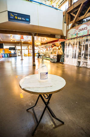 Vancouver, Canada - Apr 7, 2020: Hand sanitizer dispenser, Granville Island Public Market during...