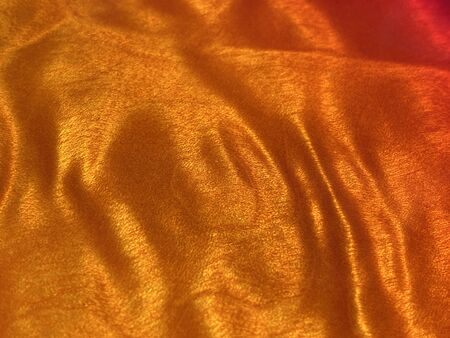 orange quilted maple wood. Background or texture.の写真素材