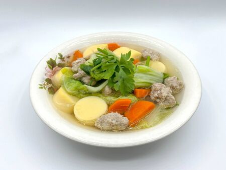 Clear Soup with Bean Curd and Minced Pork with white background.の写真素材