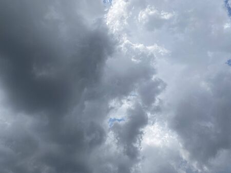 Dark blue stormy cloudy sky natural background.の写真素材