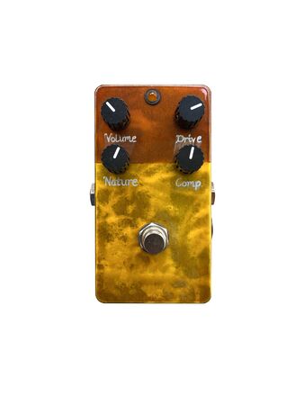 Isolated gold and brown vintage overdrive stomp box effect on white background with work path.の写真素材