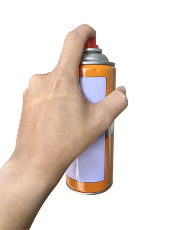 Isolated The hand of a person holding an orange spray can on white background with work path.の写真素材