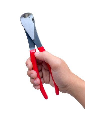 The man's hand is holding red pincers cutting tool. Isolated on white background with work path.の写真素材