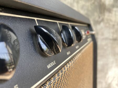 Close-up black knob,vintage combo amplifier.