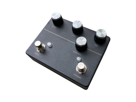 Isolated black boutique vintage Overdrive stomp box effect for electric guitar on white background with work path. Side view photos.の写真素材