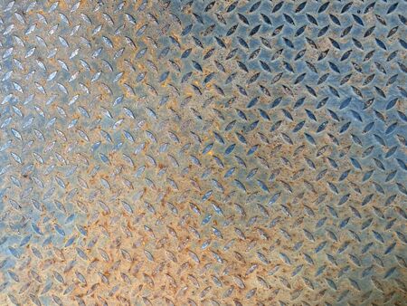 Old gray metal flooring and rust brown patches In the factory with copy space. wallpaper,background or texture.の写真素材