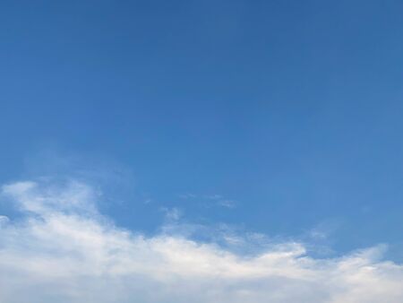 Sunset blue sky That light shines down with power With clouds that are overcast. copy space, wallpaper and background or texture.の写真素材