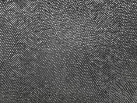 black snake skin background is luxurious. When placing your product, it will make the product look elegant and expensive, perfect for watches or white products. copy space for your textの写真素材