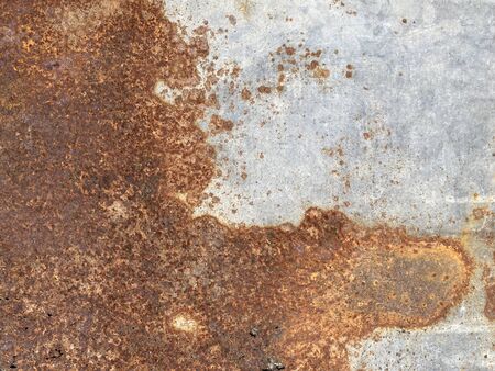 Yellow brown rust and dirt on Zinc Sheet. Rusted brown and satin silver abstract texture. metal surface rusted spots.metal rust background.の写真素材