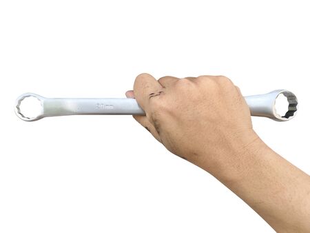 hands of people who are stained with oil from machines Holding a ring wrench on white backgroundの写真素材