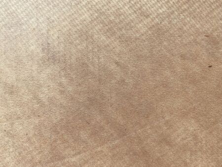 Close-up photos of the brown paper box in the top view, with spotlight from the window. With beautiful gradation, copy space for text and letter. banner and advertising concept. Background or texture.の写真素材