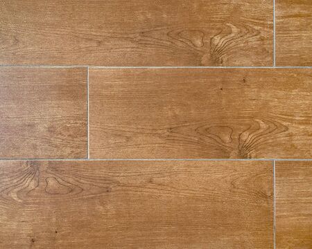 The tile flooring has a brown wood backdrop and is used to paste the product to look more beautiful with the text copying area. Wallpaper, background or texture. top view shot.の写真素材