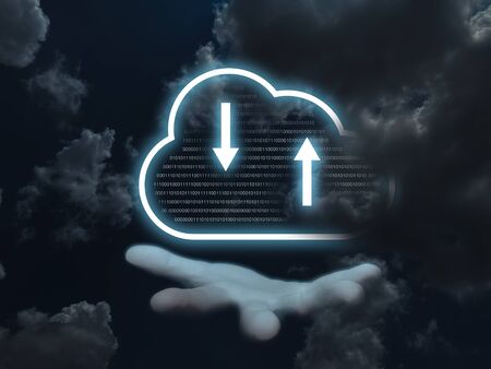 The hand of the businessman who is opening hands And a glowing blue cloud icon on the hand used to store data around the world, with a dark sky background. Cloud technology concept.の写真素材