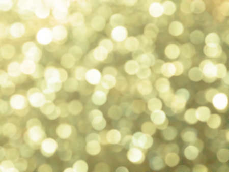 Abstract colorful gold yellow bokeh Look bright effect texture on black background. glitter vintage...
