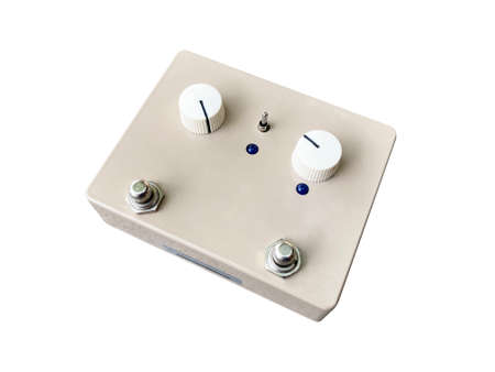 Isolated vintage cream white overdrive stompbox electric guitar effect  for studio and stage performed on white background  . side view photo.  music concept.の写真素材