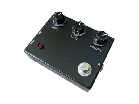 Isolated black overdrive stompbox electric guitar effect for studio and stage performed on white background with clipping path. side view photo. music concept.の写真素材