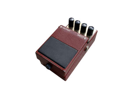 Isolated dark red overdrive British style stompbox electric guitar effect for studio and stage...
