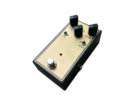 Isolated Gold boutique overdrive British style sound stompbox electric guitar effect for studio and stage performed on white background  . side view photo. music concept.の写真素材