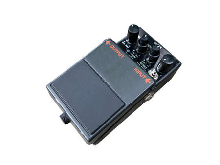 Isolated metallic black modifier distortion stompbox electric guitar effect for studio and stage performed on white backgroundの写真素材