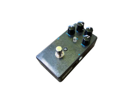 Isolated black metallic glitter distortion stompbox electric guitar effect for studio and stage performed on white backgroundの写真素材