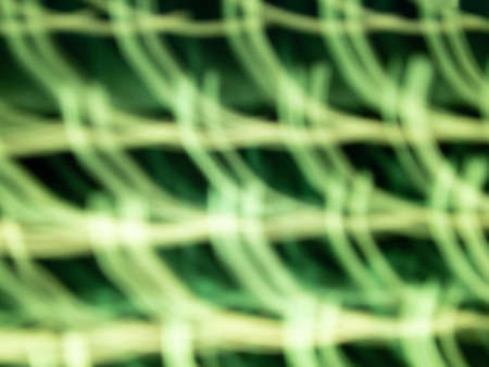 defocused green light len flare background in low shutter speed condition can use for overlay, texture and background in graphic design. technology concept.の写真素材