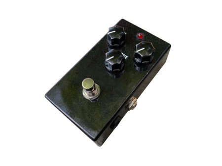 Isolated Black metallic overdrive stompbox electric guitar effect for studio and stage performed on white background  . side view photo. music concept.の写真素材