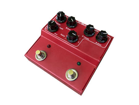 Isolated red dual-channel booster overdrive stompbox electric guitar effect for studio and stage performed on white background . side view photo. music concept.の写真素材