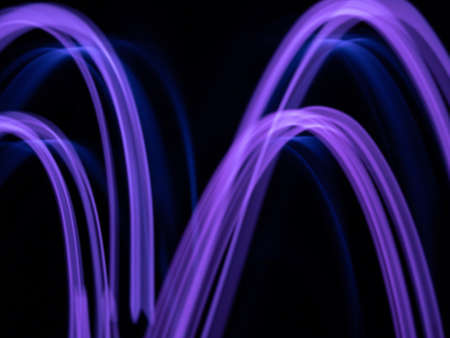 defocused purple neon lighting len flare wave pattern background in low shutter speed condition can use for overlay, texture and background in graphic design. technology concept.の写真素材